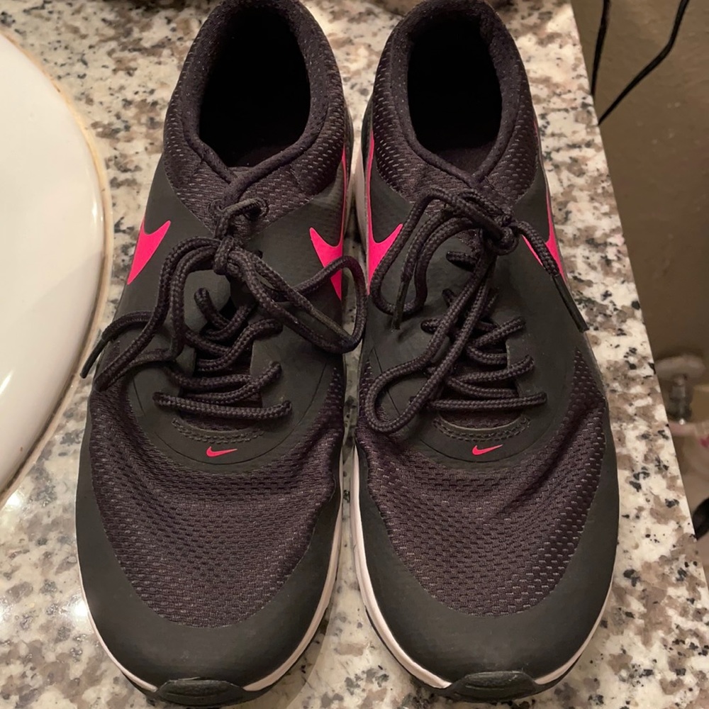 Black with pink Nike sign tennis